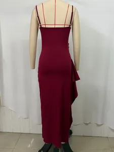 Detail view of burgundy maxi dress featuring spaghetti straps and ruffled side pleats