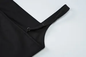 Detail of adjustable black dress shoulder strap with premium silver metal buckle hardware