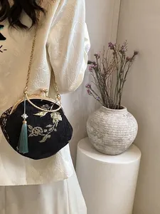 New Chinese style crossbody bag with gold floral embroidery and tassel on metal chain