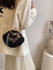 Retro Chinese style embroidered clasp bag with gold floral patterns and metal chain strap