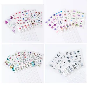 Detail of floral watercolor nail art stickers showing rose and leaf water transfer designs