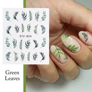 Detailed view of green leaf nail art stickers with tropical palm and fern patterns