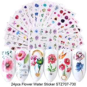 Close-up of 24pcs colorful floral nail water stickers with butterfly and leaf designs