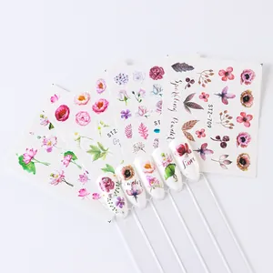 Detailed view of floral nail water decals with colorful lotus and peony designs