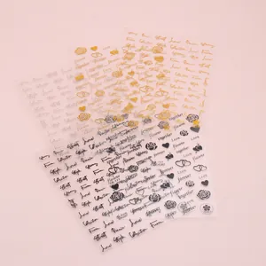 Detail of rose and heart pattern nail stickers in black gold and silver colors