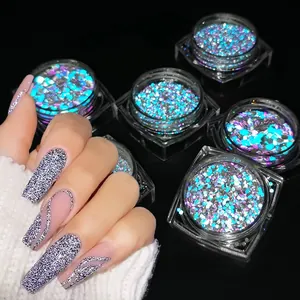 Macro view of reflective holographic blue nail glitter with sequins on long nails