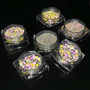 Macro shot of 6-color reflective nail glitter powder set under flash light effect