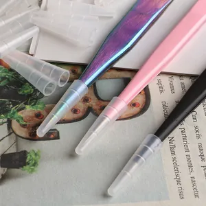 Detailed macro view of colorful precision eyelash tweezers with silicone protective caps