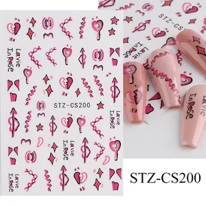 Detail von rosa Graffiti Nagelaufklebern mit Herzmotiven und Lavie In Rose Text