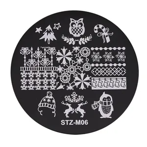Macro shot of STZ-M06 nail art plate with Christmas owls, snowflakes, and festive patterns