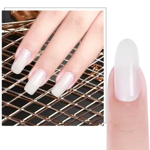 Translucent milky white nail extensions with high gloss finish on rose gold background