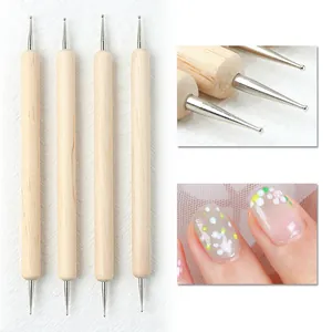 Set of 4 double-ended wooden dotting tools with various sizes of polished metal ball heads