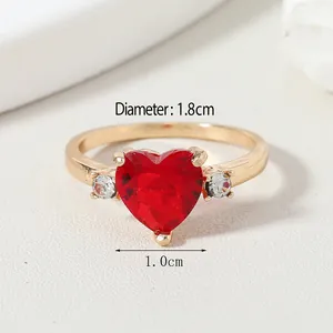 Detailed view of heart-shaped ruby ring in gold with 1.8cm diameter and 1.0cm stone size