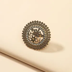 Vintage bohemian gold hollow round ring with crystals and ethnic floral patterns