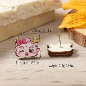 Detailed view of pink wooden dragon earrings with dimensions and weight info