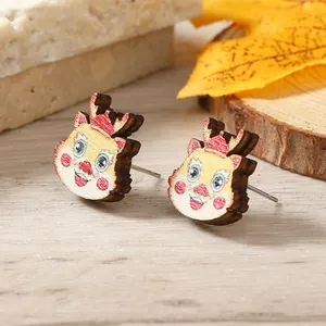 Close-up of wooden dragon earrings with festive red and yellow colors for 2024 New Year