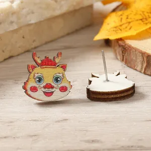 Detailed macro view of cartoon dragon wooden stud earrings on a rustic wood background