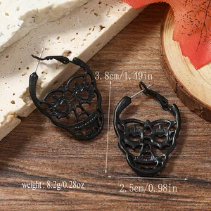 Detailed size view of black skull drop earrings with height 3.8cm and width 2.5cm