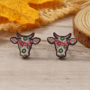 Cow head stud earrings featuring colorful floral and geometric patterns for women