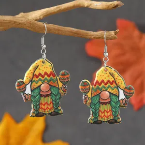 Vue détaillée de boucles d'oreilles nains en acrylique sur une branche d'arbre