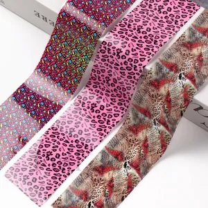 Detailed view of leopard and zebra print nail foil stickers with pop art and animal patterns