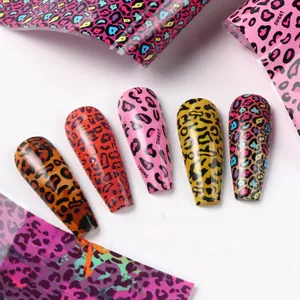 Detailed view of leopard print nail transfer foils in vibrant colors with a glossy finish