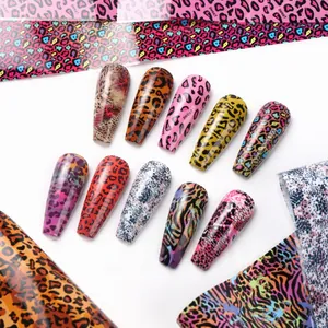 Detailed view of leopard and zebra print nail foil stickers with trendy animal patterns