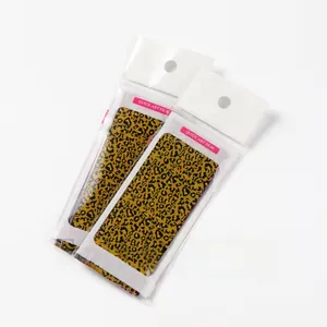 Detail view of two leopard print nail art transfer foils in professional packaging