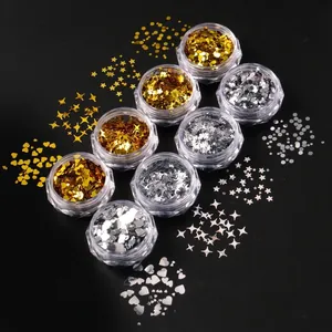 8 jars of gold and silver nail art sequins in star, heart, and round shapes on black