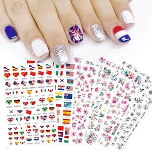 Détail de stickers nail art 3D avec drapeaux nationaux, fleurs et motifs papillons