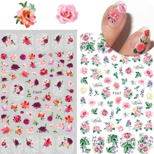 Détails macro des autocollants ongles F667 et F669 avec roses 3D et motifs floraux