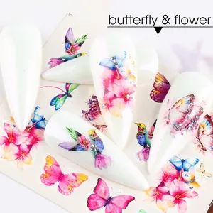 Detail of colorful butterfly and flower water decals applied on stiletto nails