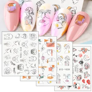 Artistic line drawing nail stickers featuring minimalist face and floral patterns