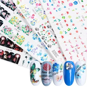 Detail of floral nail art water stickers with colorful roses and butterfly patterns