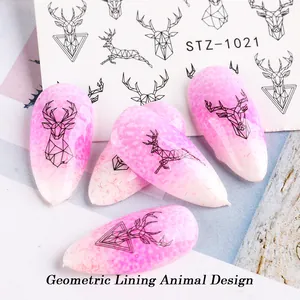 Detail of STZ-1021 geometric deer nail art stickers applied on pink gradient false nails