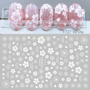 Detail of white cherry blossom nail stickers showing application on nails and layout