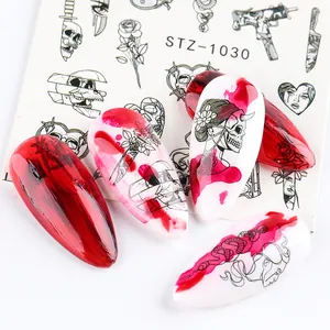 Detailed view of Gothic water nail stickers with black skull, snake and floral line art designs