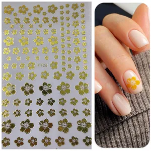Detail of 3D gold foil floral nail stickers with model hand display and F726 pattern