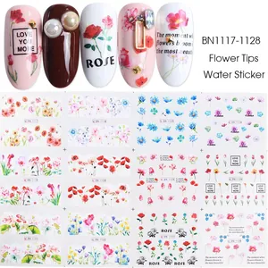 Close-up of flower water transfer nail art stickers with mixed floral patterns and text