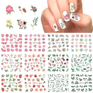 Set of 12 floral and strawberry nail art stickers with various botanical patterns