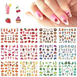 Close-up of 12-sheet nail art sticker set featuring colorful fruit and food patterns