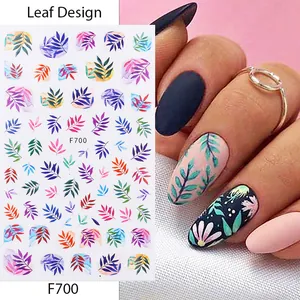 Detail view of F700 leaf design nail stickers with colorful botanical patterns and application