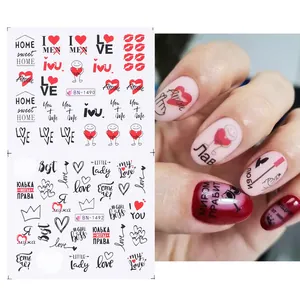 Water transfer nail stickers featuring red lips and hearts with Love phrases