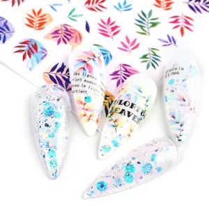 Macro detail of almond nail tips with colorful gradient leaves and chunky teal sequins