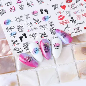 Detailed view of Russian style nail water decals with red lips and cursive script