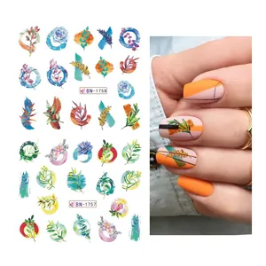 Detailed close-up of colorful watercolor floral nail stickers with real manicure effect