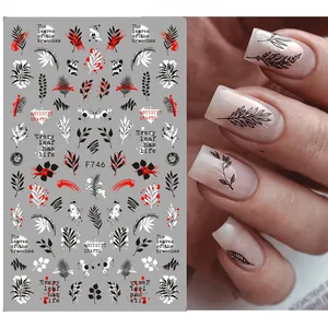 3D nail art stickers with black and white leaves and artistic punk lettering for manicure