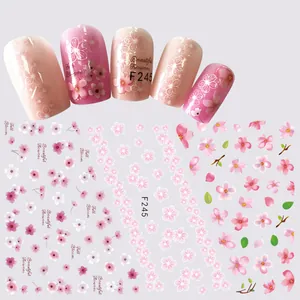 Detail of pink cherry blossom nail stickers F245 with 3D floral designs on false nails