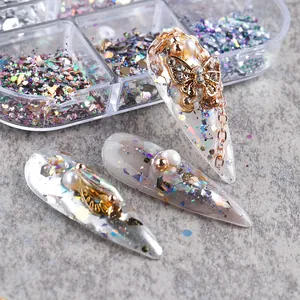 Detailed application of 3D metal butterfly pendants and iridescent nail art glitter sequins