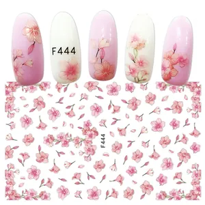 Detail of 3D self-adhesive nail stickers featuring pink floral cherry blossom patterns